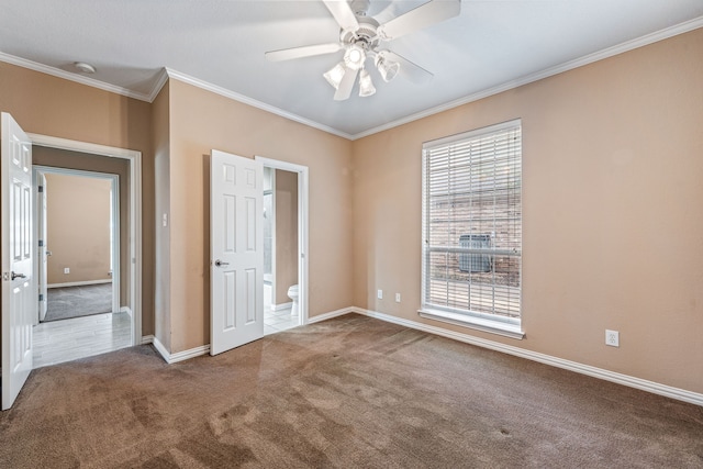 unfurnished room with ceiling fan, crown molding, a healthy amount of sunlight, and carpet