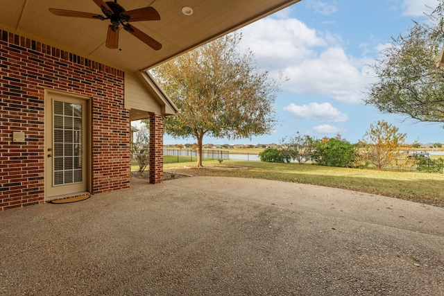 view of yard featuring ceiling fan and a patio area