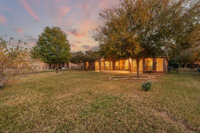 view of yard at dusk