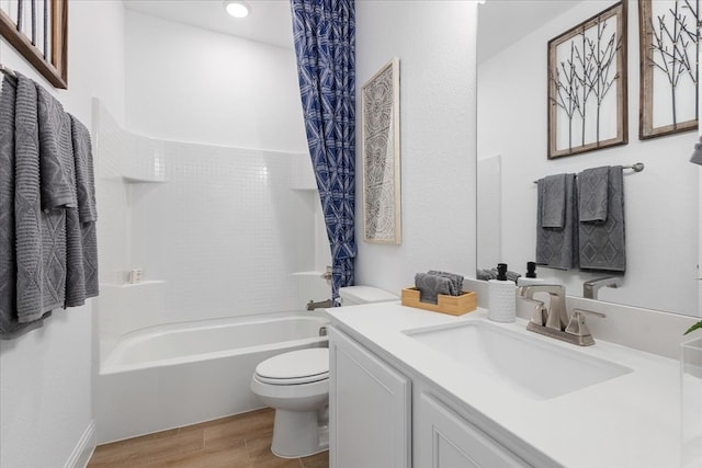 full bathroom with washtub / shower combination, toilet, wood-type flooring, and vanity