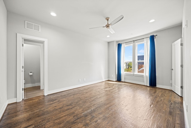 unfurnished room with ceiling fan and dark hardwood / wood-style floors