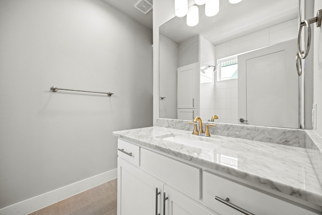 bathroom featuring tile patterned flooring and vanity