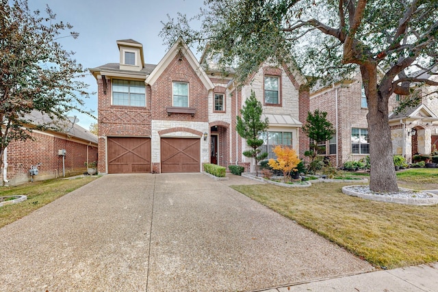 view of front facade featuring a front yard and a garage