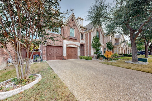 view of front facade featuring a front lawn and a garage