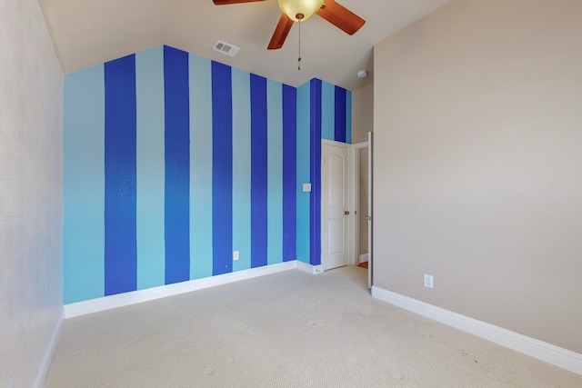 unfurnished room featuring carpet floors, visible vents, a ceiling fan, baseboards, and wallpapered walls