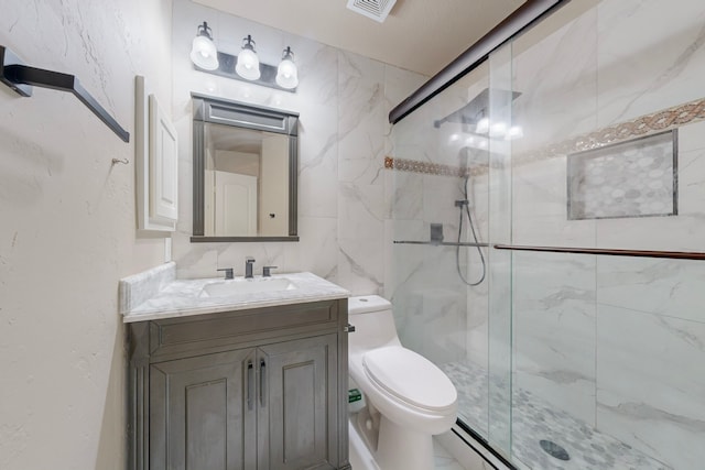 full bathroom with visible vents, toilet, vanity, a shower stall, and tile walls