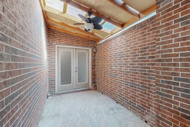 view of patio with a ceiling fan and french doors