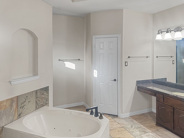 bathroom featuring vanity and a bath