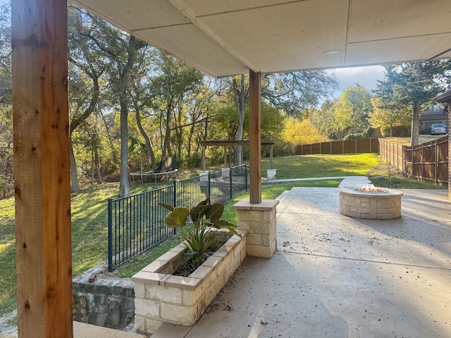 view of patio with a fire pit