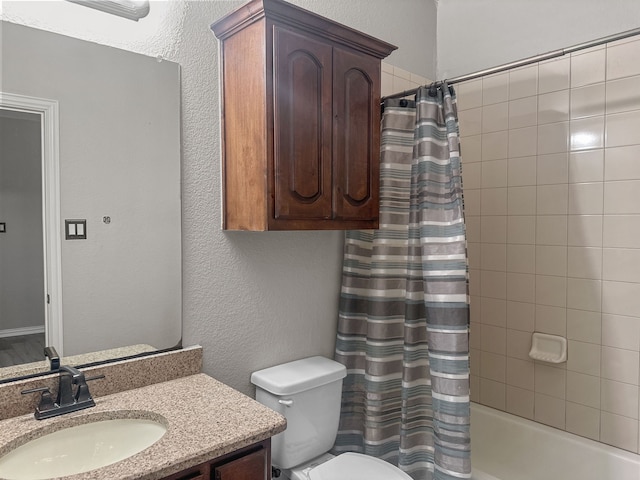 full bathroom featuring vanity, shower / bath combination with curtain, and toilet