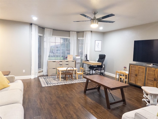 living room with ceiling fan and dark wood-type flooring