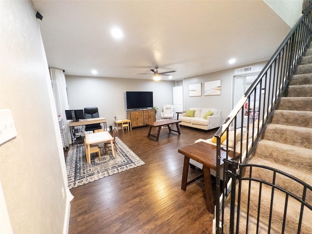 living room with ceiling fan and dark hardwood / wood-style floors