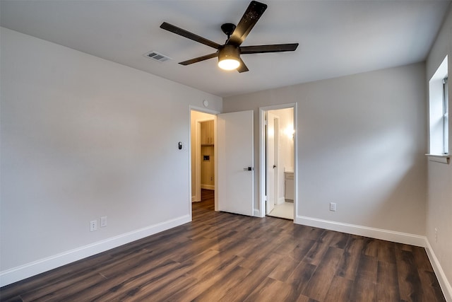 unfurnished bedroom with ceiling fan, dark hardwood / wood-style flooring, and ensuite bathroom