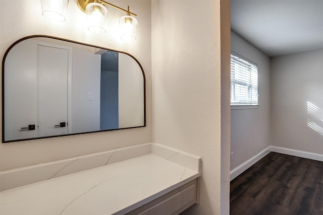 bathroom with hardwood / wood-style flooring