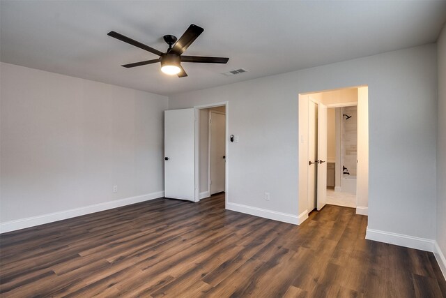 unfurnished bedroom featuring dark hardwood / wood-style floors and ceiling fan