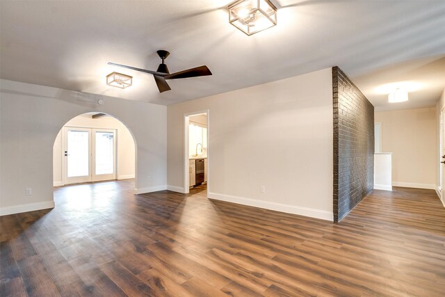 empty room featuring dark hardwood / wood-style floors and ceiling fan