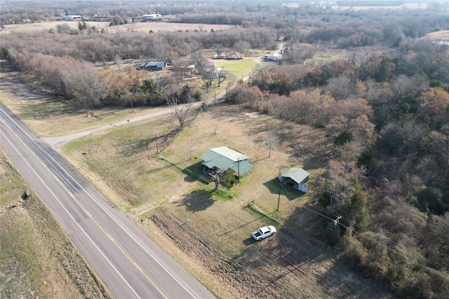 birds eye view of property with a rural view