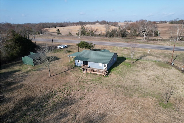 birds eye view of property featuring a rural view