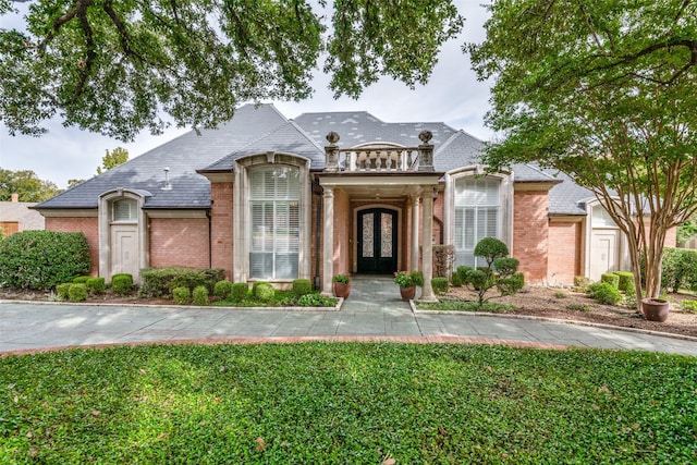 french provincial home featuring french doors