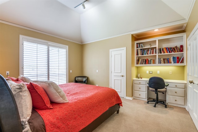 bedroom with crown molding, track lighting, vaulted ceiling, and light carpet