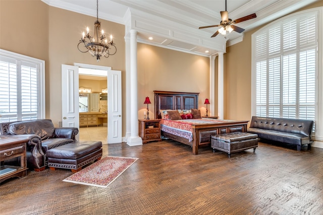 bedroom with crown molding and decorative columns