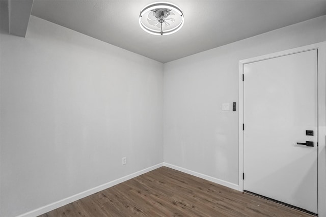 empty room with dark hardwood / wood-style floors