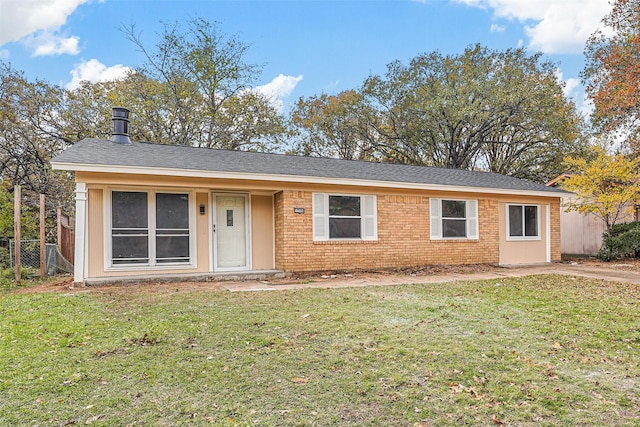 ranch-style home with a front lawn