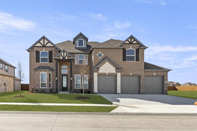 view of front of house featuring a garage and a front yard