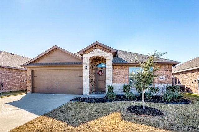 single story home featuring a front yard and a garage