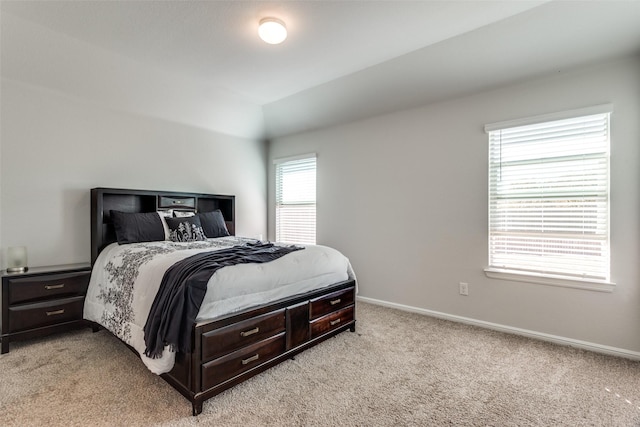 bedroom with light colored carpet