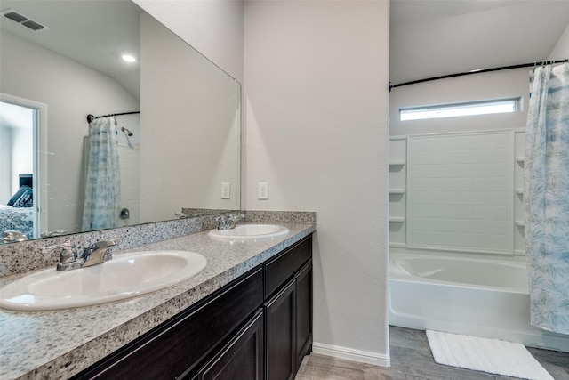 bathroom featuring shower / tub combo with curtain, vanity, and tile patterned flooring