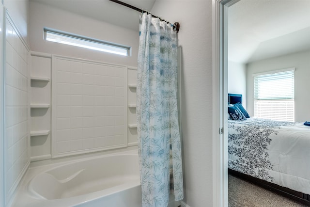 bathroom with shower / tub combo with curtain