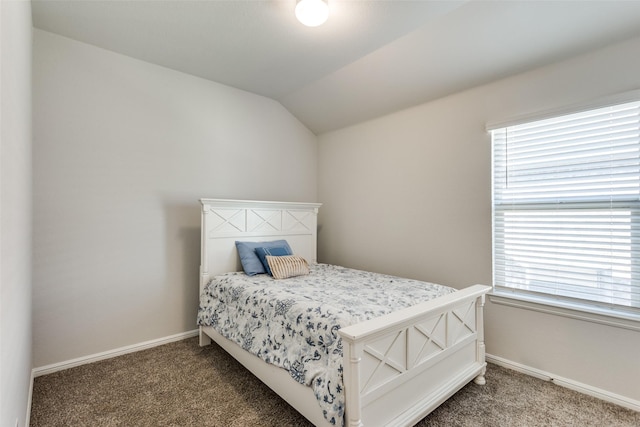 carpeted bedroom with vaulted ceiling