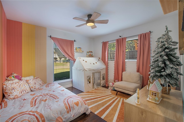 bedroom with hardwood / wood-style flooring and ceiling fan