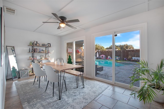 dining room featuring light tile patterned floors and ceiling fan