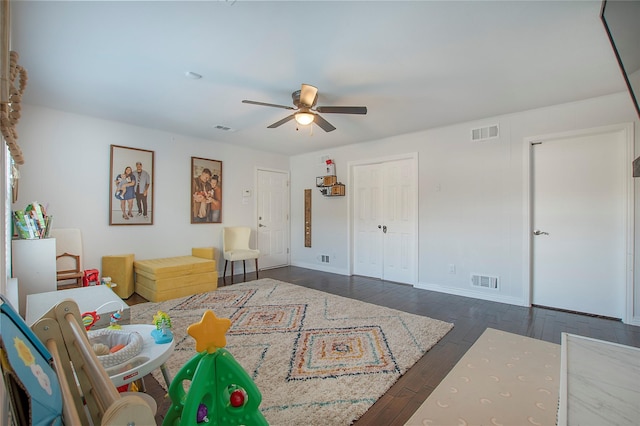 bedroom with dark wood-type flooring and ceiling fan