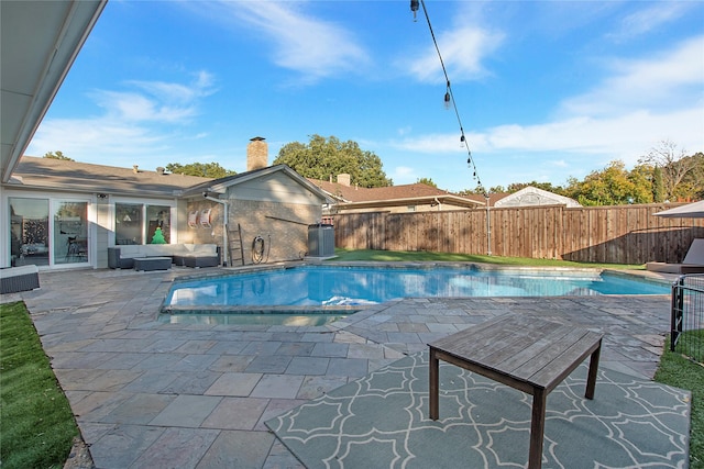 view of swimming pool featuring a patio area