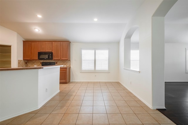 15646 Gatehouse Dr, Fort Worth, TX 76262 - kitchen featuring black microwave, decorative backsplash, healthy amount of natural light, light tile patterned floors, and recessed lighting