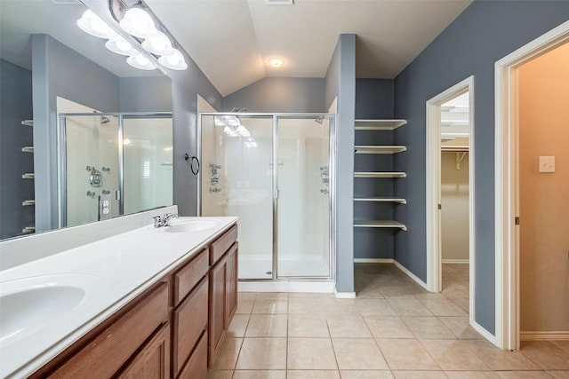 15646 Gatehouse Dr, Fort Worth, TX 76262 - bathroom with a shower stall, tile patterned floors, lofted ceiling, a walk in closet, and double vanity