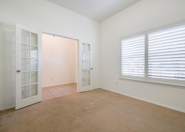 15646 Gatehouse Dr, Fort Worth, TX 76262 - tiled spare room featuring french doors, carpet flooring, and baseboards