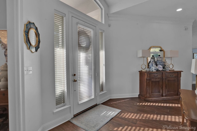 entryway featuring dark wood-type flooring and ornamental molding