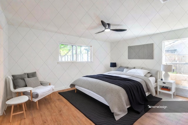 bedroom with hardwood / wood-style flooring and ceiling fan