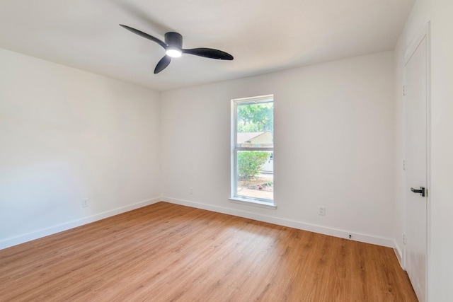 empty room featuring ceiling fan and light wood-type flooring