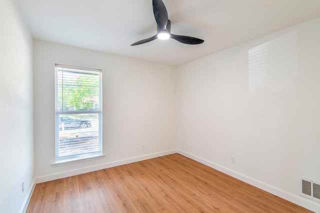 empty room featuring ceiling fan and light wood-type flooring