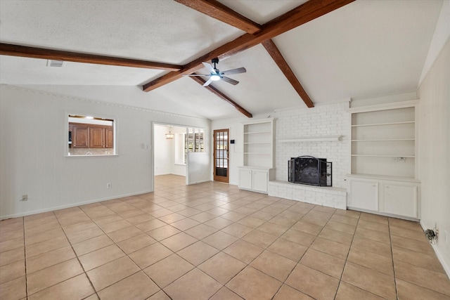 unfurnished living room featuring vaulted ceiling with beams, a textured ceiling, light tile patterned floors, a brick fireplace, and ceiling fan