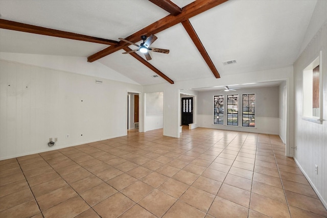 unfurnished living room featuring ceiling fan, lofted ceiling with beams, and light tile patterned floors