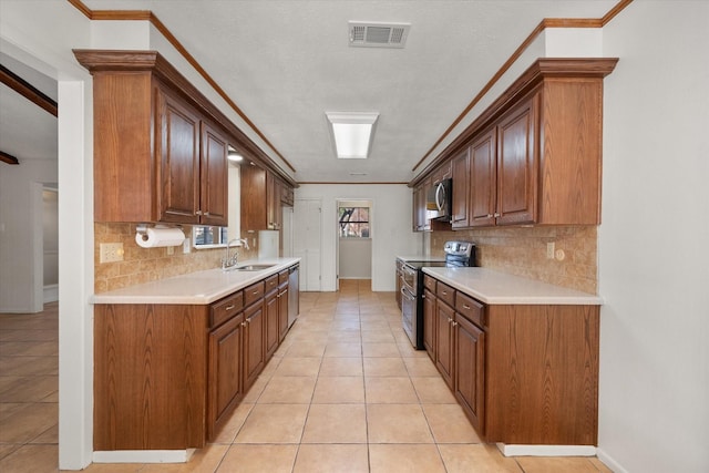 kitchen featuring sink, crown molding, appliances with stainless steel finishes, tasteful backsplash, and light tile patterned flooring