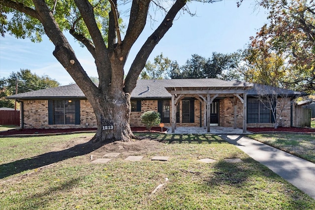 1213 Lexington Dr, Corsicana, TX 75110 - ranch-style home with brick siding, roof with shingles, and a porch