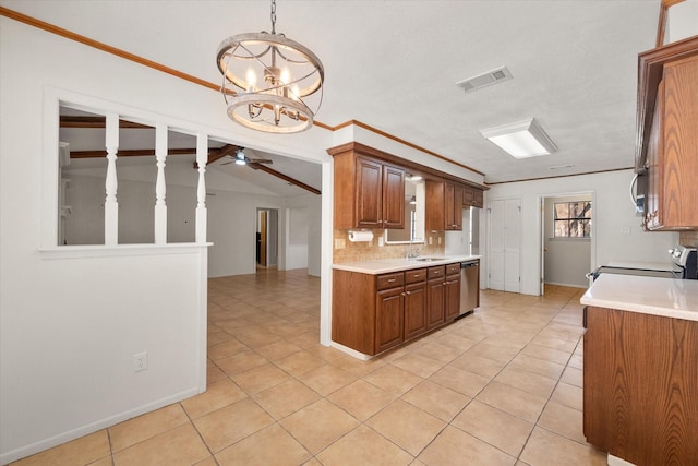 kitchen with light tile patterned flooring, tasteful backsplash, decorative light fixtures, appliances with stainless steel finishes, and ceiling fan with notable chandelier