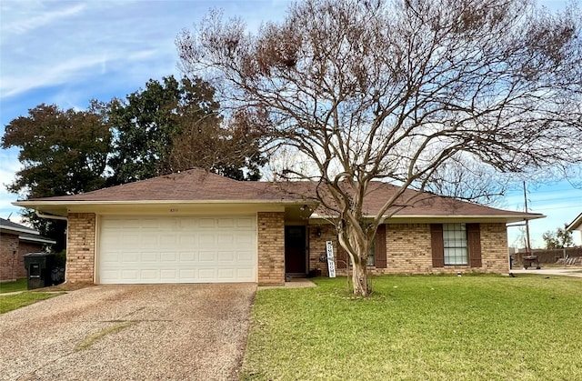 single story home with a garage and a front lawn